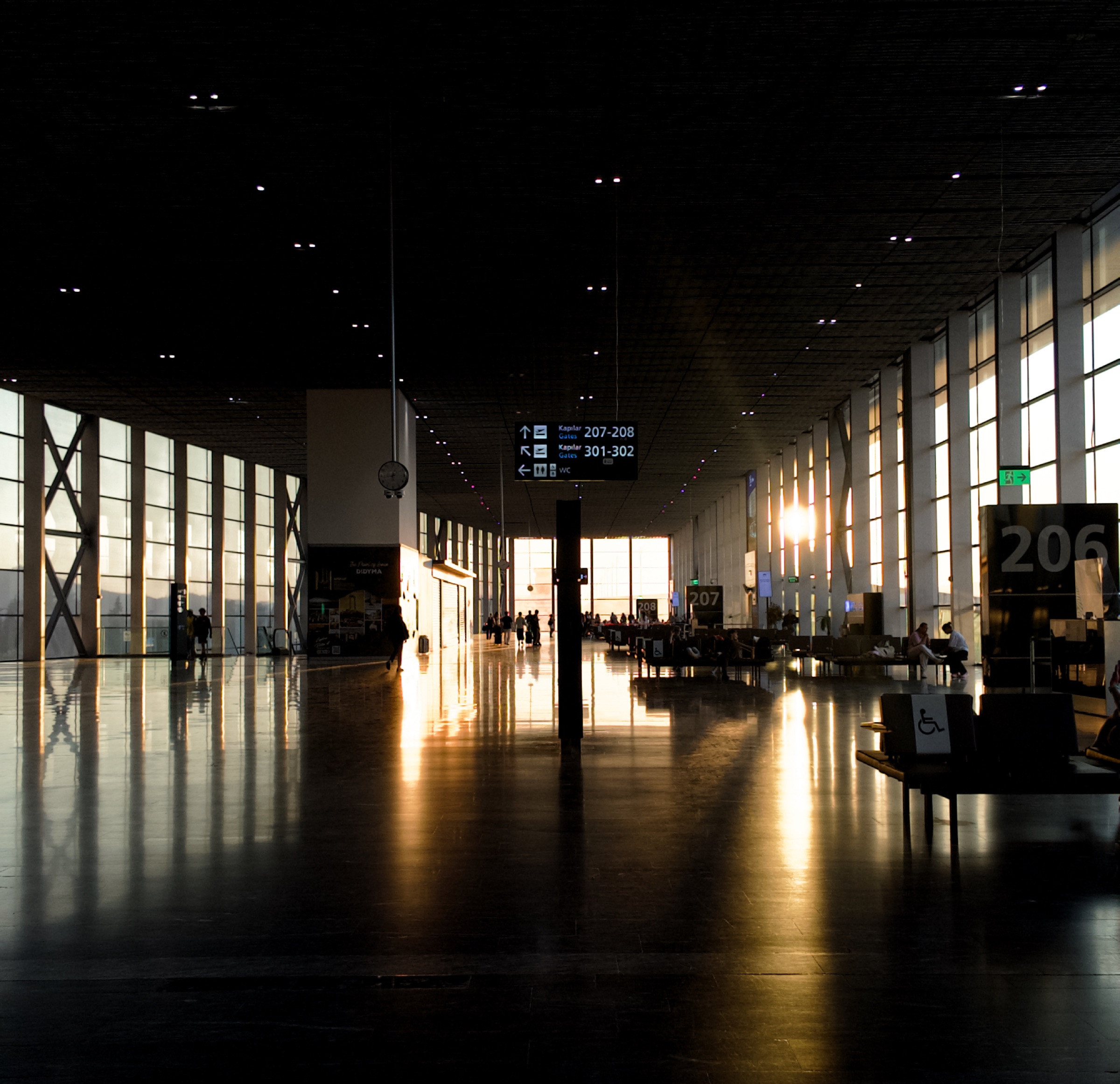 Golden evening light reflected across the floor of Bodrum airport