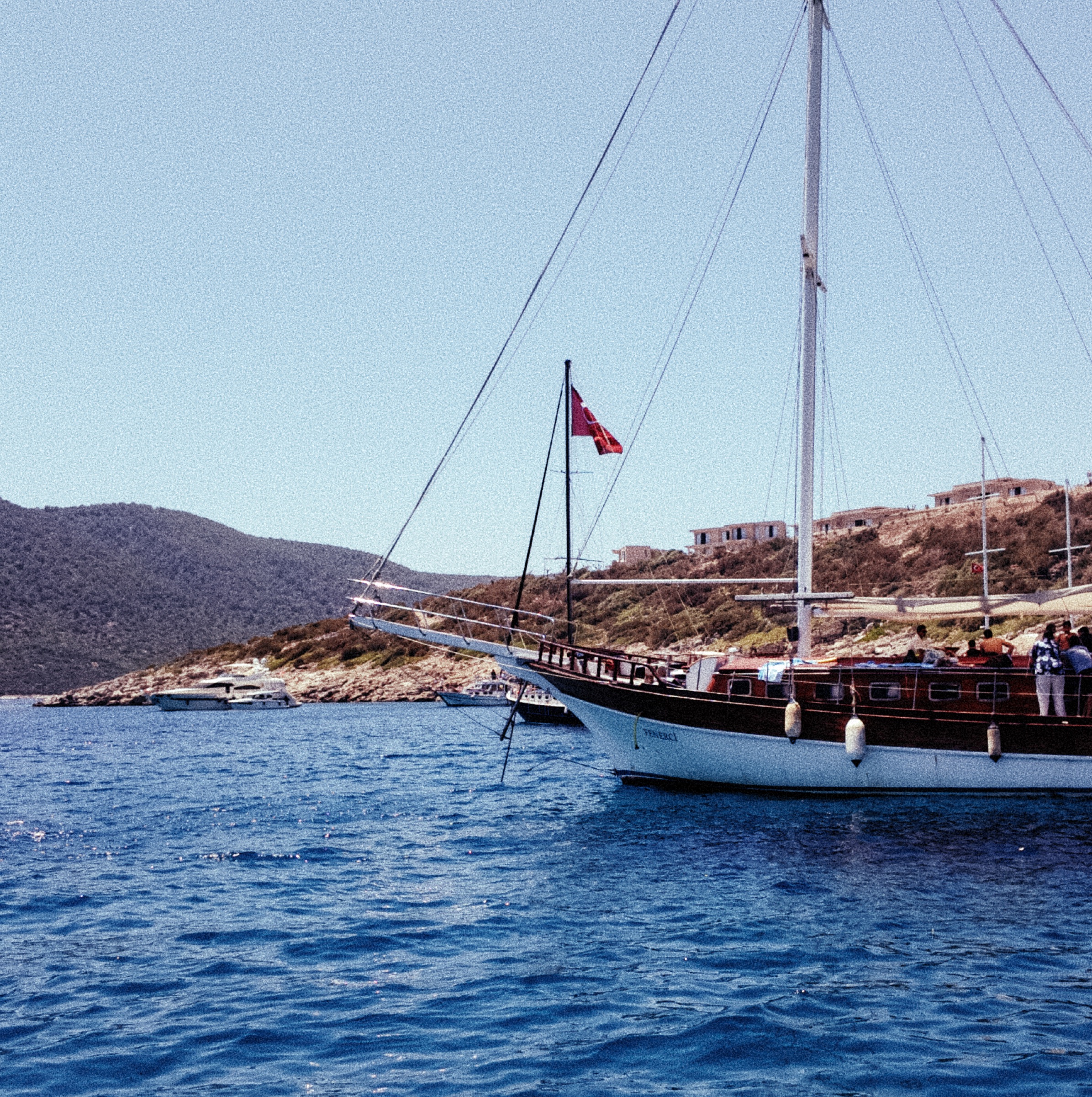 Traditional Turkish gulet floating in blue water near Kara Ada